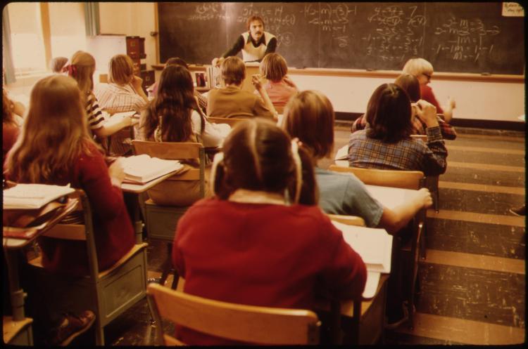 STUDENTS AND TEACHER IN A CLASSROOM AT CATHEDRAL HIGH SCHOOL IN NEW ULM MINNESOTA. THE TOWN IS A COUNTY SEAT TRADING NARA 558214